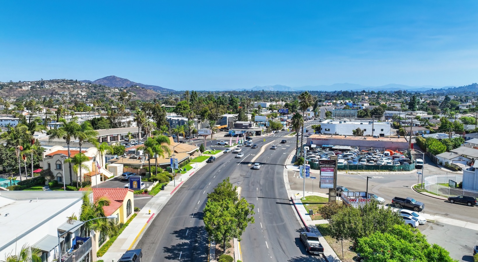 Bustling community with plenty of dining choices a wide road with many buildings