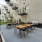 a spacious patio with tables and chairs
