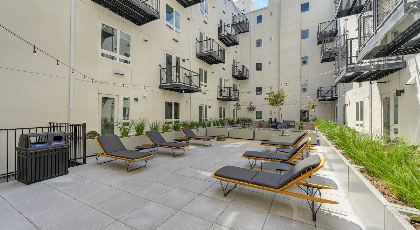 Access to resident-only features a group of outdoor chairs near landscaping