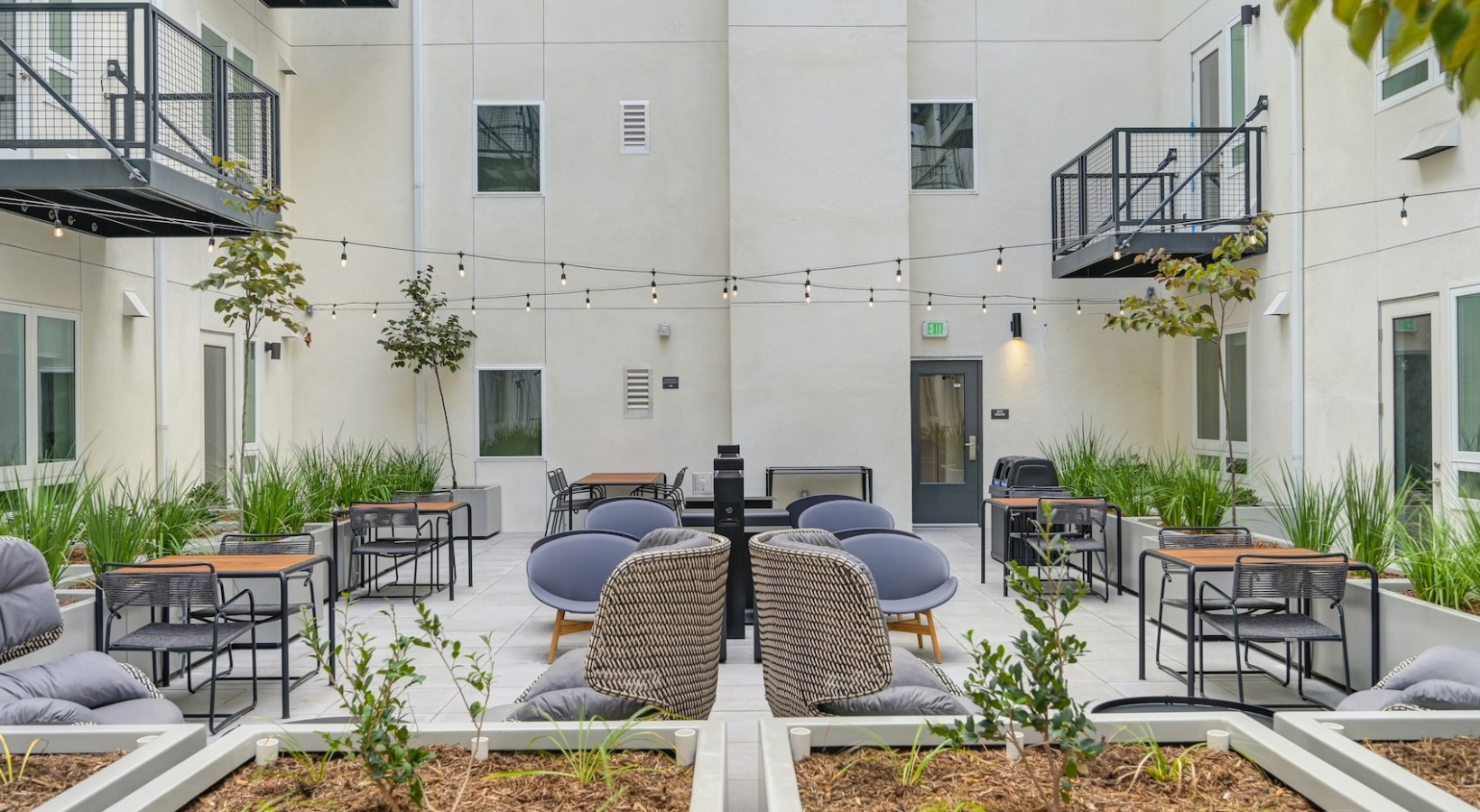 Access to resident-only features a spacious courtyard with many plants