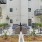 a spacious courtyard with many plants